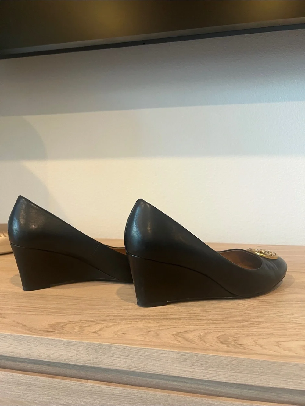 Tory Burch Black Leather Wedge Pumps with Gold Logo Medallion